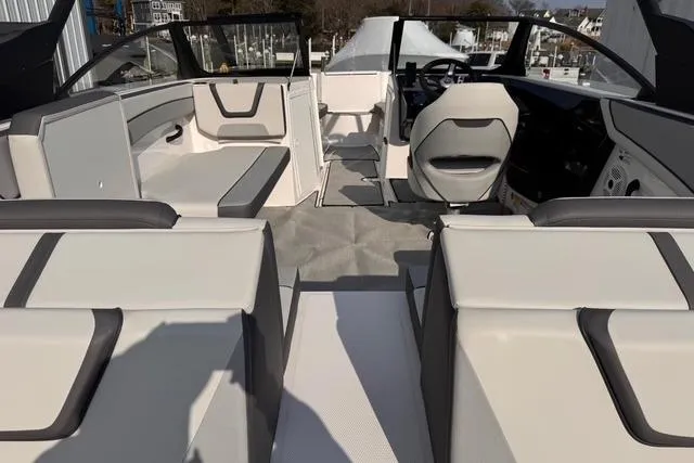 Slide: The Image of 2023 Yamaha Boats AR220 interior with modern seating and sleek design. - 4