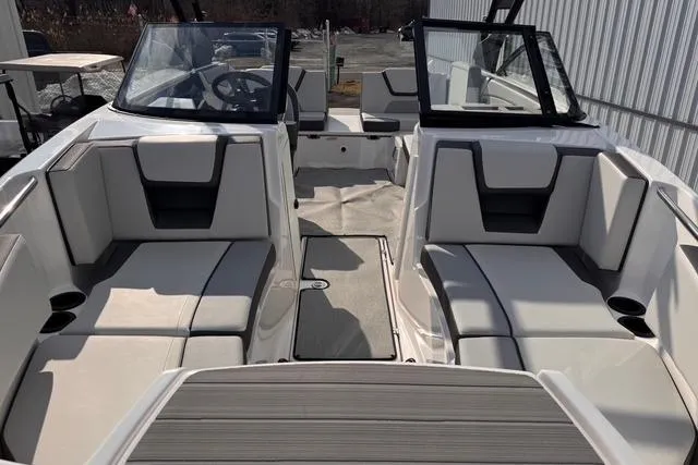 Slide: The Image of 2023 Yamaha Boats AR220 interior with sleek seating and modern design. - 5