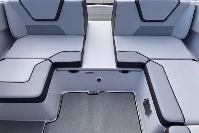 Slide: The Image of 2023 Yamaha Boats AR220 interior seating with modern gray upholstery and sleek design. - 8