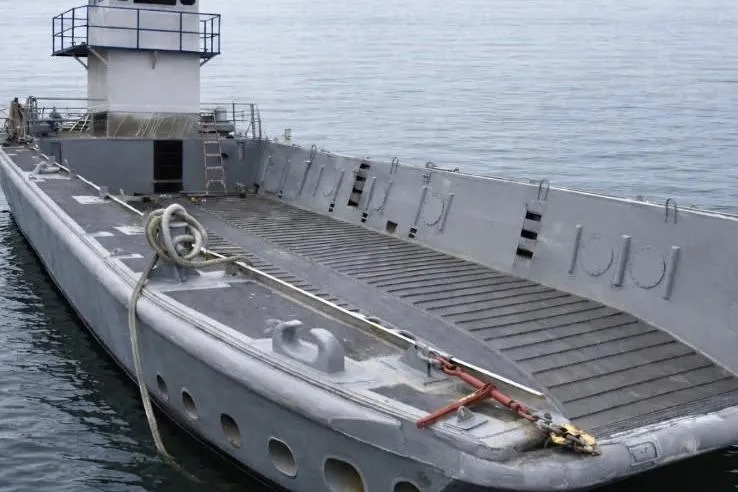 The Image of 1987 Commercial LCU 8 vessel on calm water, featuring a spacious deck and control tower. - 0