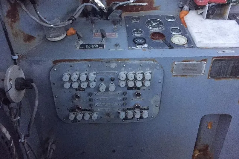 Slide: The Image of Control panel of a 1987 Commercial LCU 8 vessel with gauges and switches. - 14