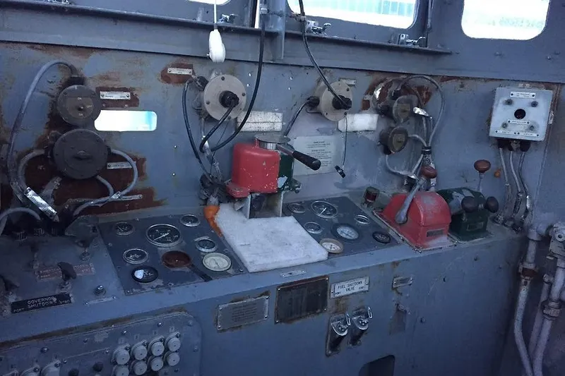 Slide: The Image of Control panel of a 1987 Commercial LCU 8 vessel with gauges and levers. - 15