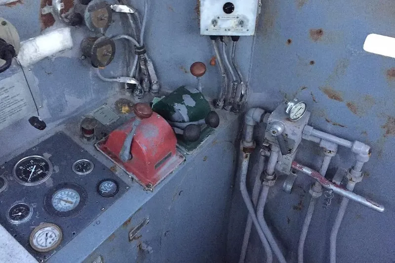 Slide: The Image of Control panel of a 1987 Commercial LCU 8 with gauges and levers. - 16