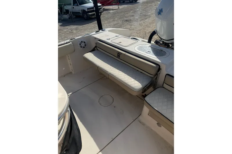 Slide: The Image of 2022 Carolina Skiff 23 UE boat interior with cushioned seating and storage. - 15