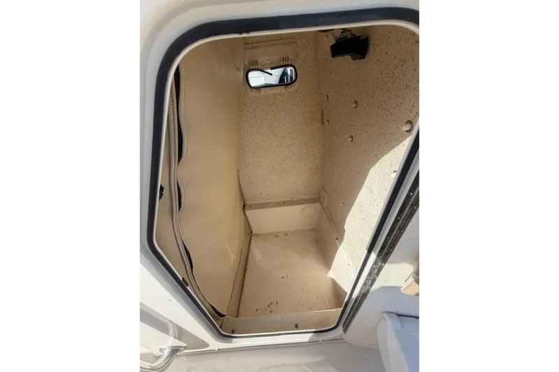 Slide: The Image of 2022 Carolina Skiff 23 UE storage compartment interior view. - 21