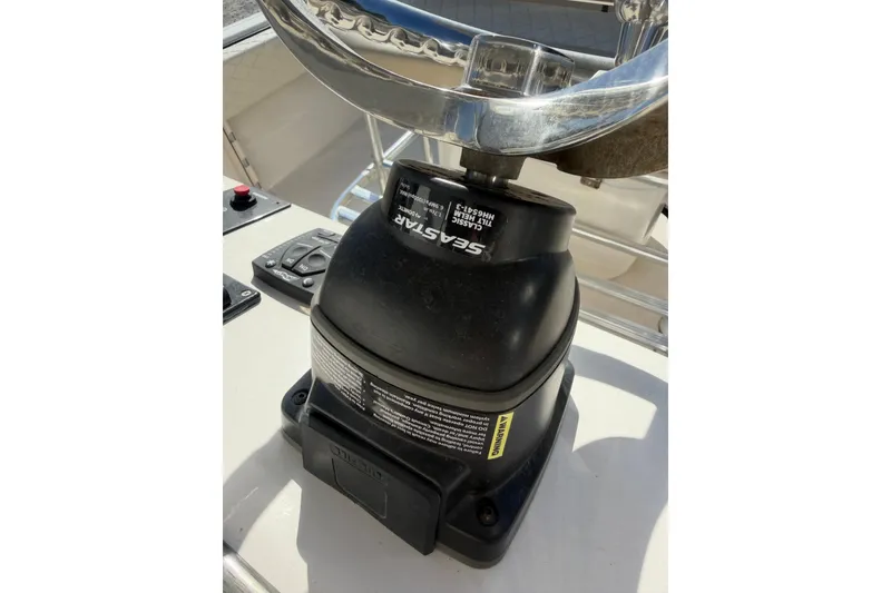 Slide: The Image of Steering mechanism of 2022 Carolina Skiff 23 UE boat, featuring SeaStar components. - 28