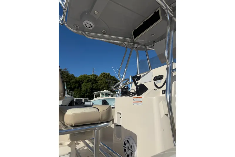 Slide: The Image of 2022 Carolina Skiff 23 UE boat interior with steering console and seating. - 4