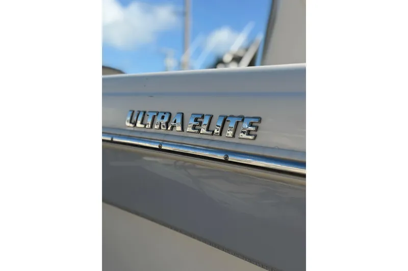 Slide: The Image of 2022 Carolina Skiff 23 UE boat with "Ultra Elite" emblem, close-up view. - 7