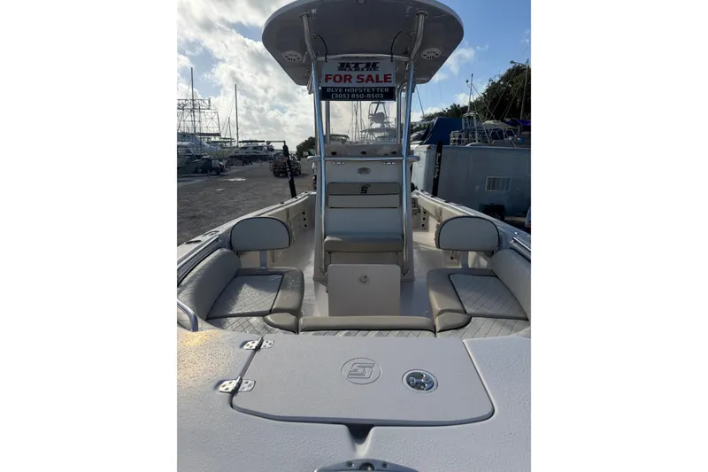 Slide: The Image of 2022 Carolina Skiff 23 UE boat for sale, docked with seating and console view. - 9