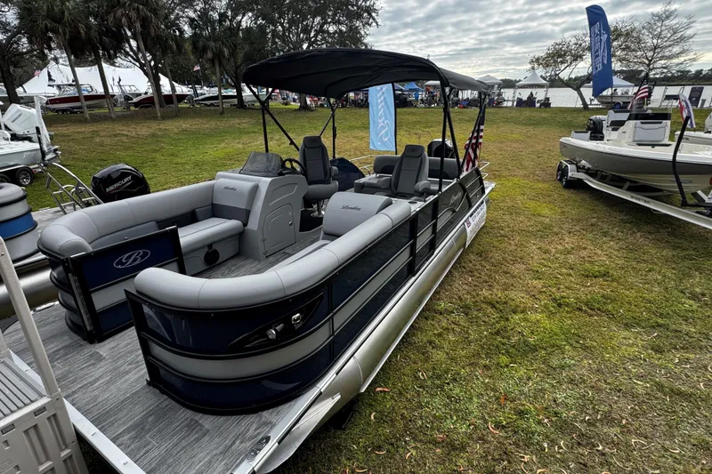 Slide: The Image of 2026 Bentley Pontoons Legacy 243 Swingback displayed outdoors on grass. - 5