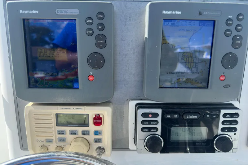 Slide: The Image of 1998 Bluewater 2150 boat dashboard with navigation equipment. - 17