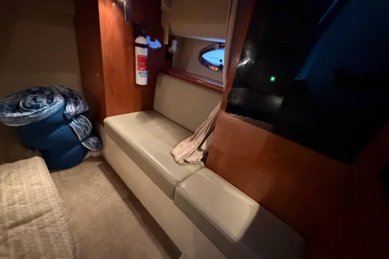 Slide: The Image of Interior of 2006 Cruisers Yachts 300 Express with seating and fire extinguisher. - 32