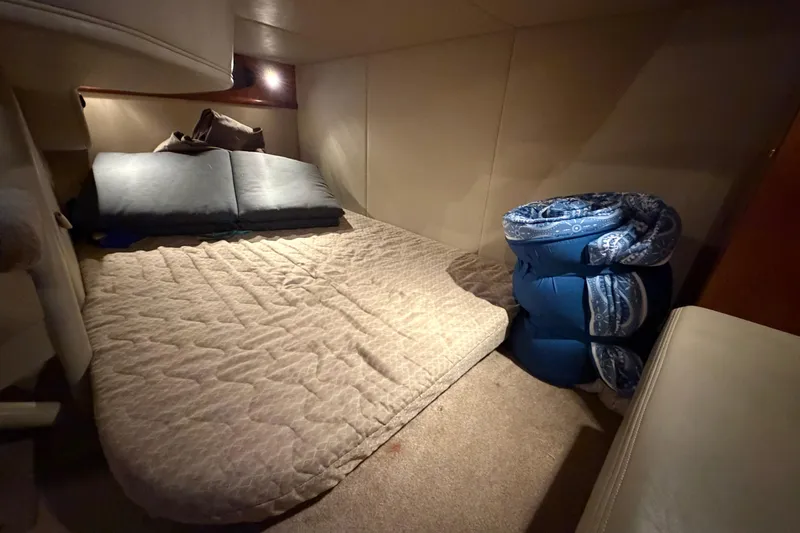 Slide: The Image of Cozy cabin interior of 2006 Cruisers Yachts 300 Express with bed and cushions. - 33