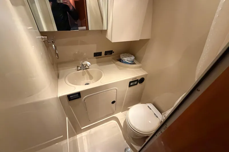 Slide: The Image of Bathroom interior of 2006 Cruisers Yachts 300 Express, featuring sink and toilet. - 37