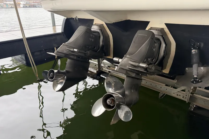 Slide: The Image of 2006 Cruisers Yachts 300 Express boat propellers and stern drive in marina. - 43