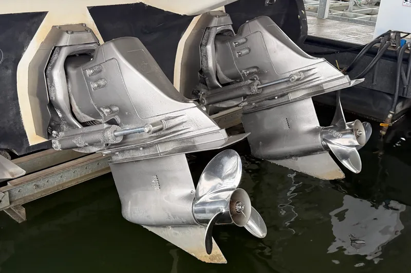 Slide: The Image of Twin propellers of a 2006 Cruisers Yachts 300 Express in a marina setting. - 44