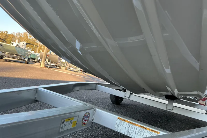 Slide: The Image of 2013 Xpress XP18CC boat hull on trailer in parking lot. - 3