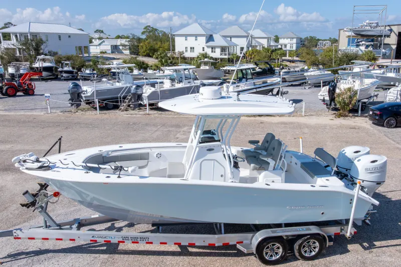 The Image of 2024 Cape Horn 24 XS boat on trailer, displayed in a marina setting. - 0