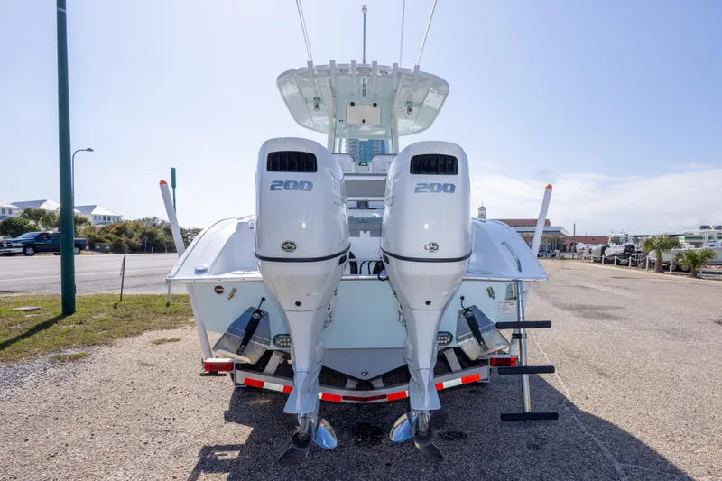 Slide: The Image of 2024 Cape Horn 24 XS boat with dual 200 horsepower engines, rear view. - 11