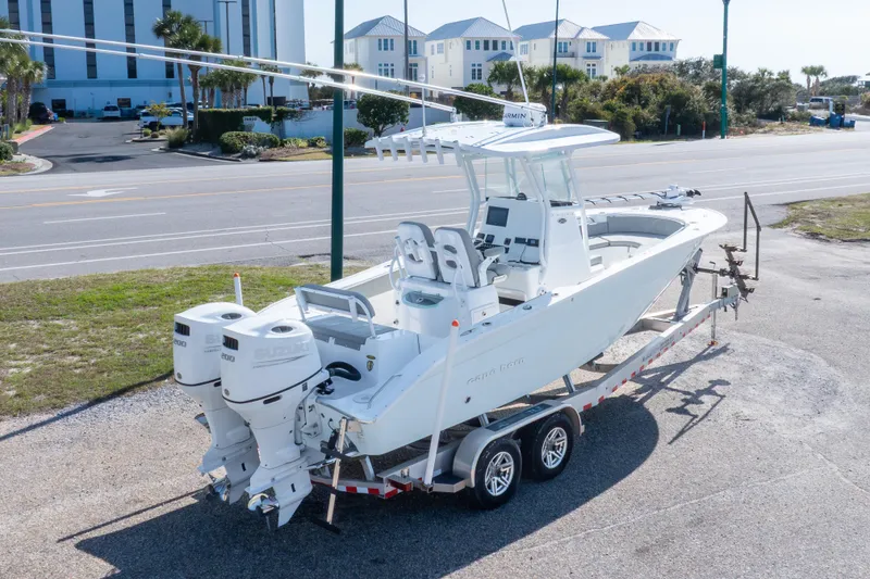Slide: The Image of 2024 Cape Horn 24 XS boat on trailer, featuring dual Suzuki outboard engines. - 16