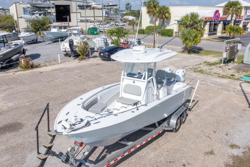 Slide: The Image of 2024 Cape Horn 24 XS boat on trailer in marina setting. - 17