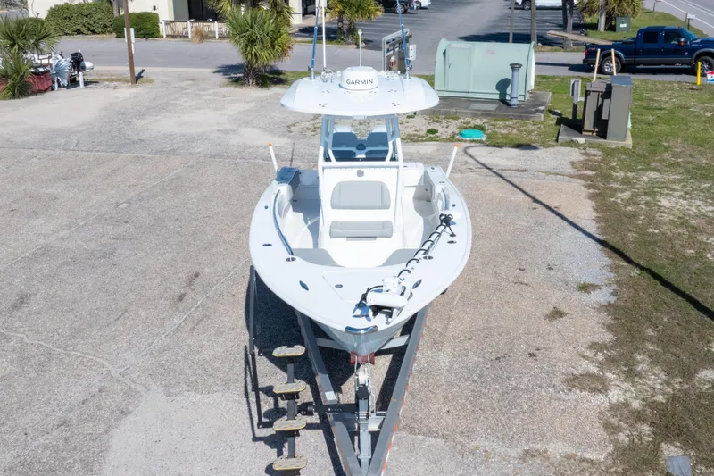 Slide: The Image of 2024 Cape Horn 24 XS boat on trailer, parked outdoors, aerial view. - 18