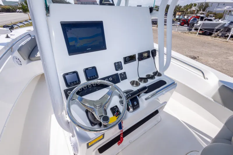 Slide: The Image of 2024 Cape Horn 24 XS boat console with steering wheel and navigation equipment. - 27