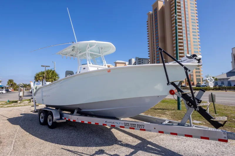 Slide: The Image of 2024 Cape Horn 24 XS boat on trailer, urban background, clear sky. - 3