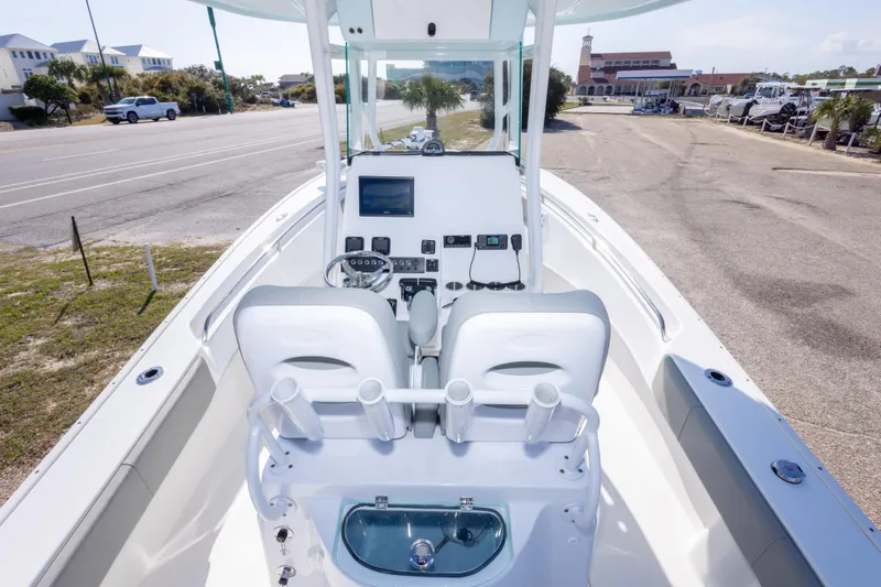 Slide: The Image of 2024 Cape Horn 24 XS boat interior with modern console and seating. - 34