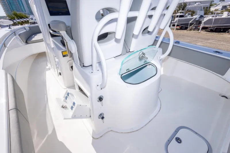 Slide: The Image of 2024 Cape Horn 24 XS boat interior with rod holders and storage compartments. - 39