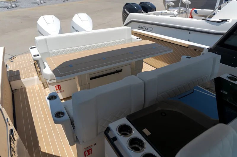 Slide: The Image of The image shows the cockpit of a 2027 Saxdor 320 GTO with sleek seating and a table. - 33
