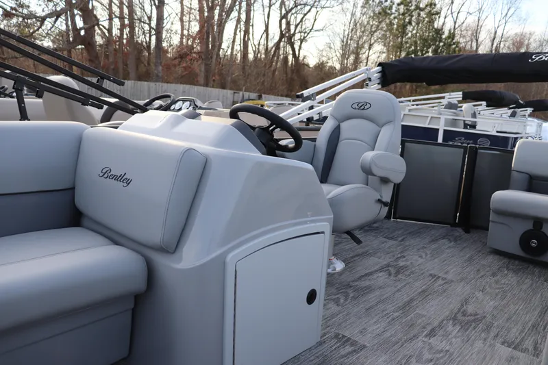 Slide: The Image of 2026 Bentley Pontoons LE 200 Cruise interior with steering wheel and seating. - 4