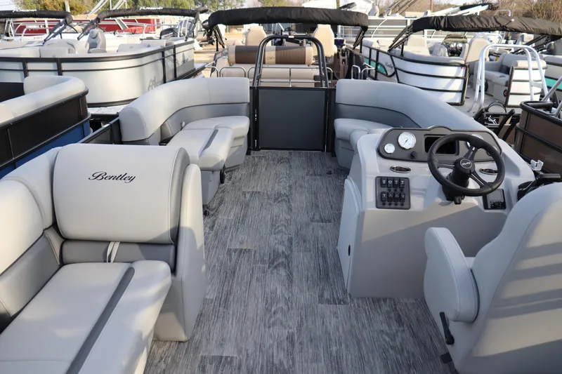 Slide: The Image of 2026 Bentley Pontoons LE 200 Cruise interior with luxurious seating and modern dashboard. - 7