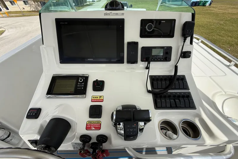 Slide: The Image of Control panel of 2016 Extreme Boats XC 38 Express with navigation and communication equipment. - 100