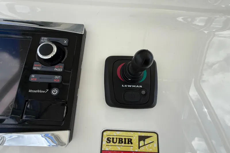 Slide: The Image of Control panel of 2016 Extreme Boats XC 38 Express with Lewmar joystick and VesselView 7 display. - 104