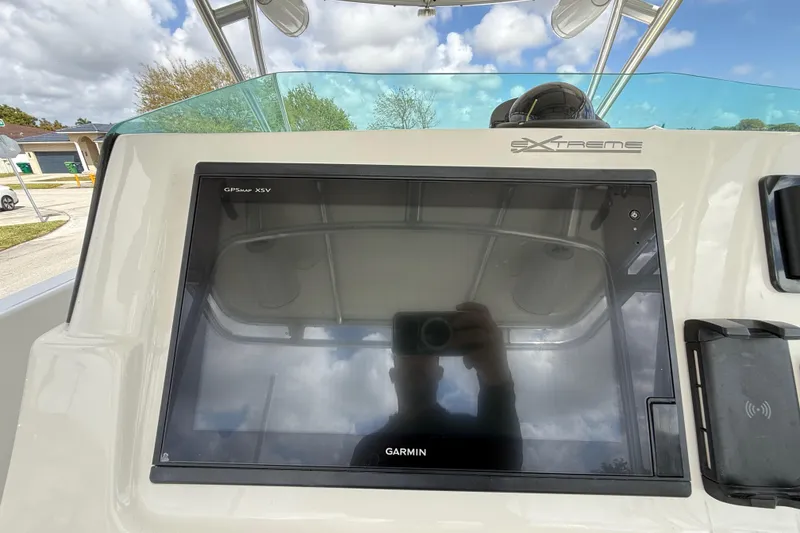 Slide: The Image of Display panel of 2016 Extreme Boats XC 38 Express showing engine hours and battery status. - 107