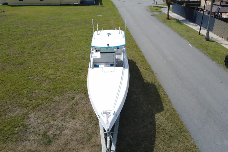 Slide: The Image of Aerial view of 2016 Extreme Boats XC 38 Express on grassy area near road. - 11