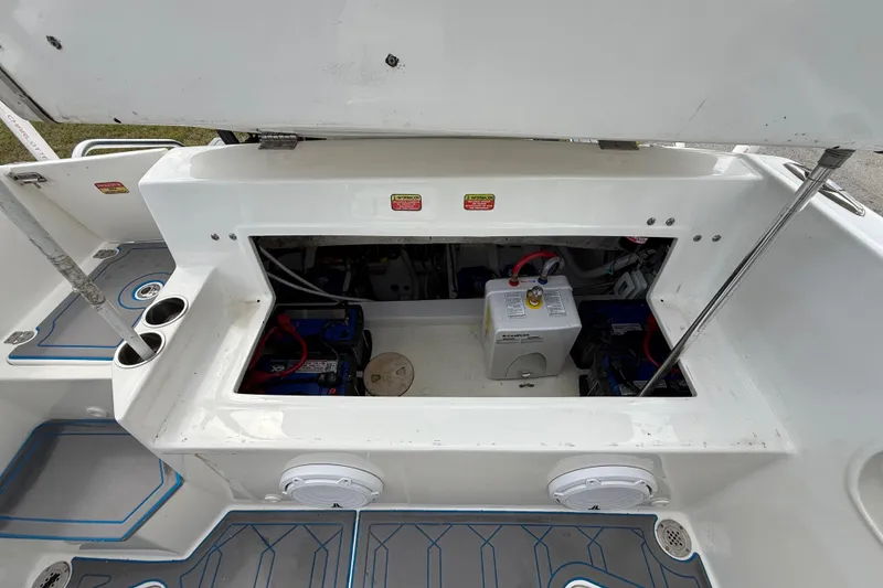 Slide: The Image of 2016 Extreme Boats XC 38 Express, rear view with blue canopy under cloudy sky. - 117