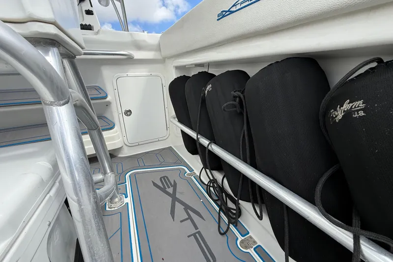 Slide: The Image of 2016 Extreme Boats XC 38 Express interior with white seating and cup holders. - 122
