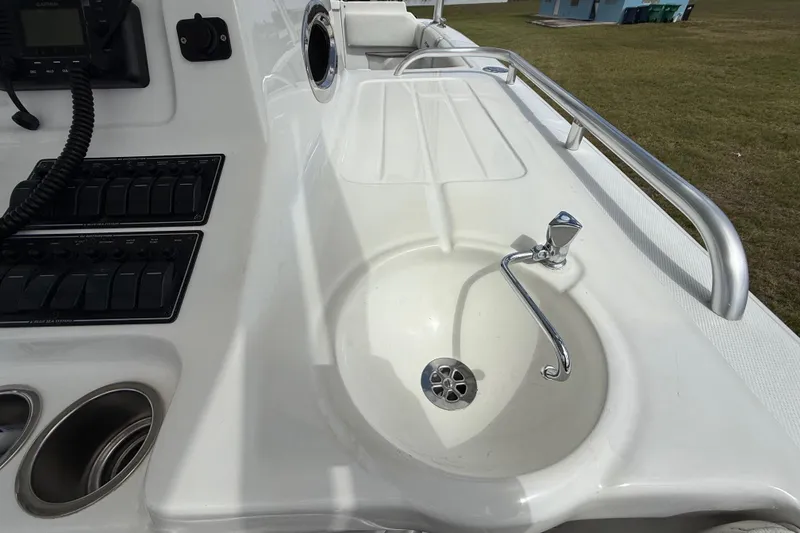 Slide: The Image of 2016 Extreme Boats XC 38 Express interior with storage compartment and non-slip flooring. - 124