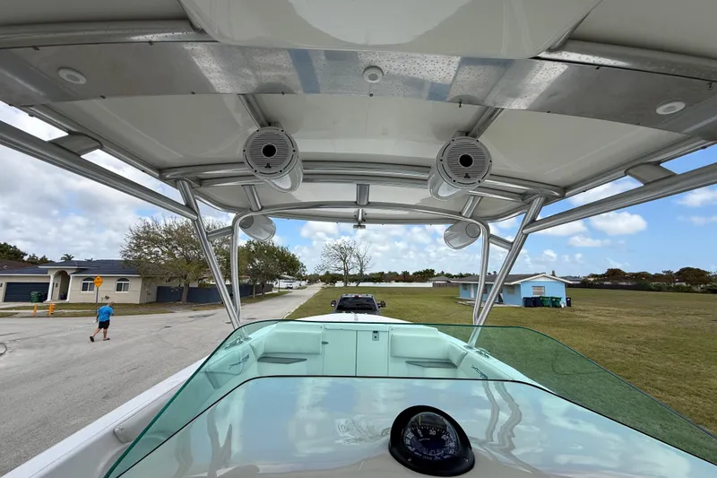 Slide: The Image of 2016 Extreme Boats XC 38 Express, view from helm, showcasing speakers and windshield. - 135