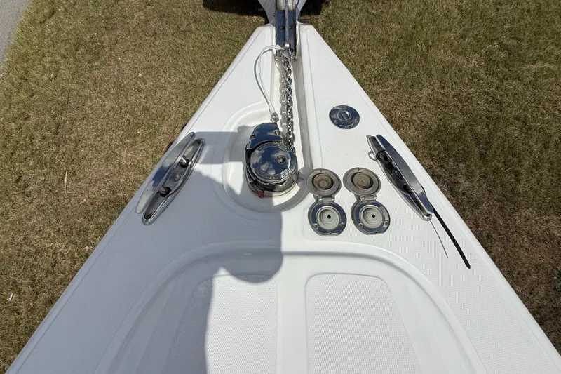 Slide: The Image of 2016 Extreme Boats XC 38 Express, white deck view, parked on grass. - 147