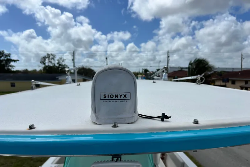 Slide: The Image of 2016 Extreme Boats XC 38 Express interior with blue and white seating and custom flooring. - 178