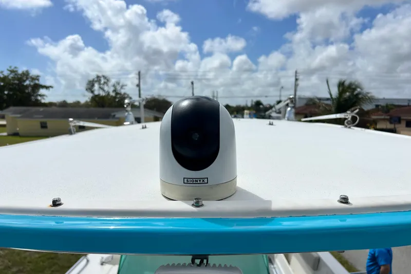 Slide: The Image of 2016 Extreme Boats XC 38 Express interior seating with blue and white cushions. - 179