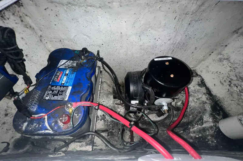 Slide: The Image of Electrical components and wiring inside a 2016 Extreme Boats XC 38 Express. - 183