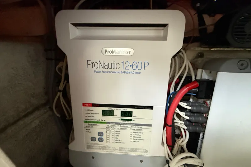 Slide: The Image of Electrical wiring and components inside a 2016 Extreme Boats XC 38 Express. - 186