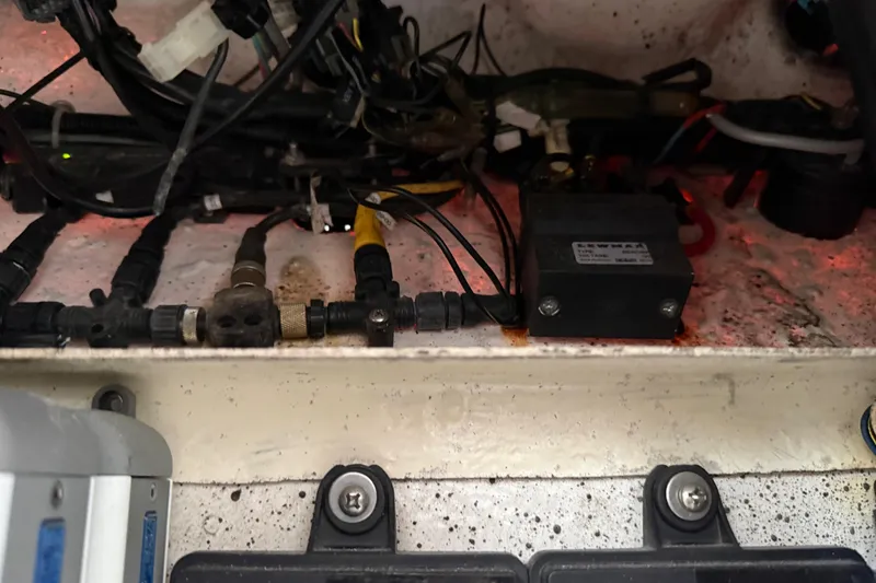 Slide: The Image of Electrical components and wiring inside a 2016 Extreme Boats XC 38 Express. - 188