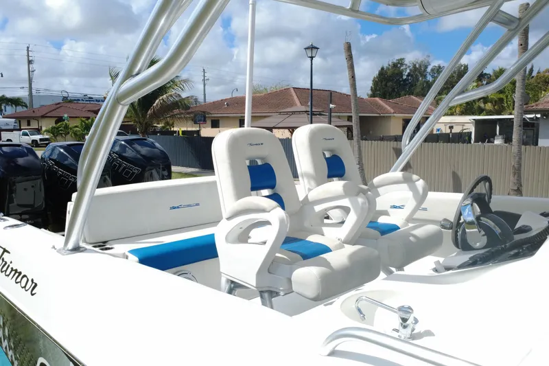 Slide: The Image of 2016 Extreme Boats XC 38 Express with dual seats and steering wheel, docked outdoors. - 19