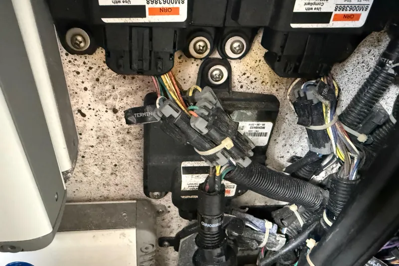 Slide: The Image of Engine compartment of 2016 Extreme Boats XC 38 Express, showing wiring and battery setup. - 191