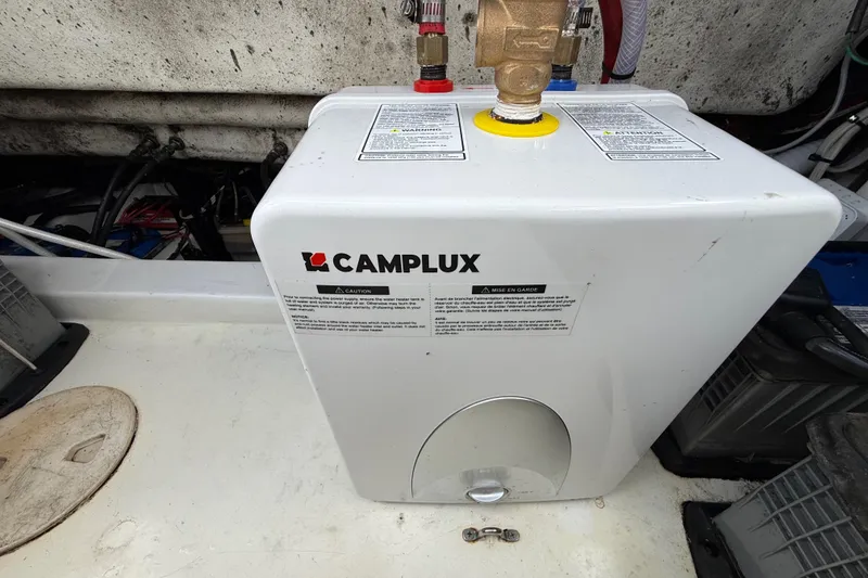 Slide: The Image of Engine compartment of 2016 Extreme Boats XC 38 Express, showcasing wiring and components. - 198